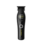 Trimmer M63, negro, de frente sobre su base de carga
